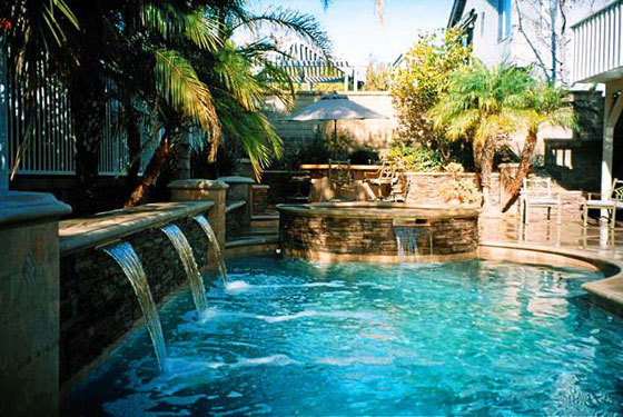 Photo of a swimming pool with multiple water falls